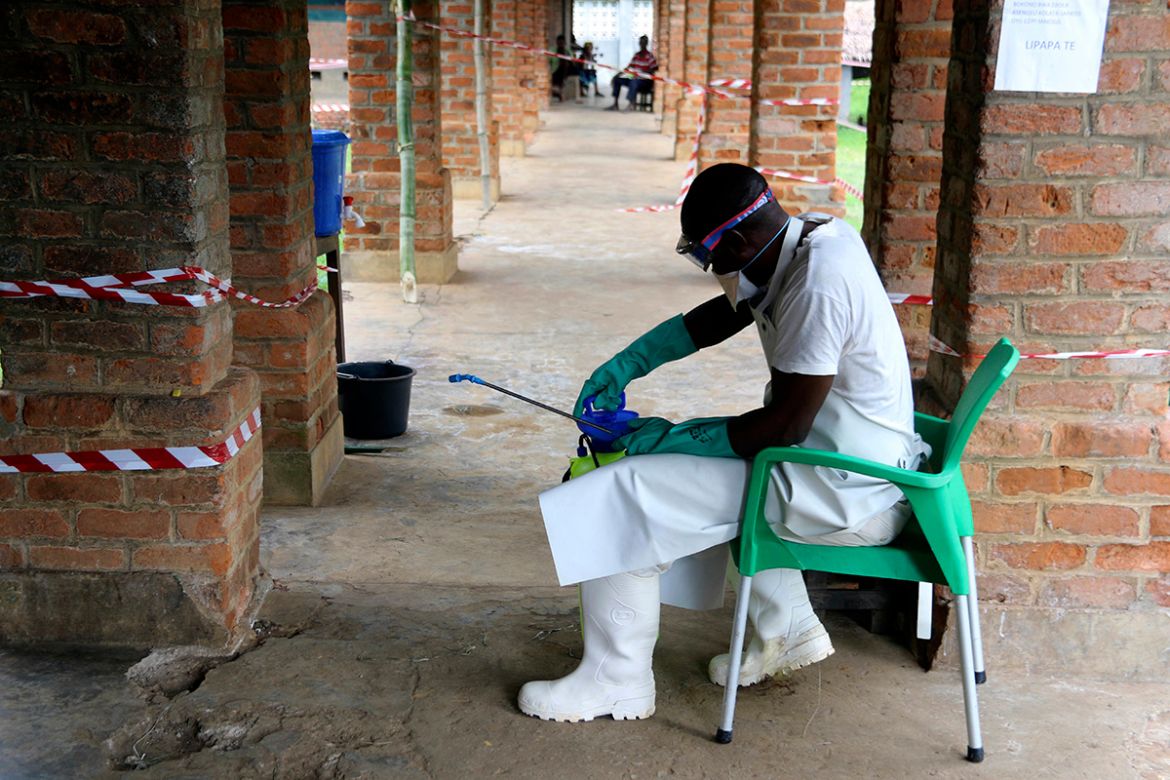 In this photo taken on Sunday, May 13, 2018, a health care worker wears virus protective gear at a treatment center in Bikoro Democratic Republic of Congo. Congo''s latest Ebola outbreak has spread to