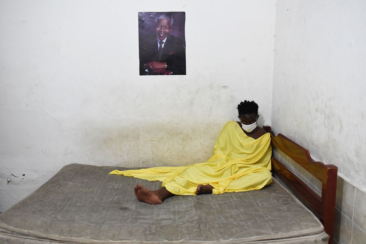 Underneath a portrait of Nelson Mandela, Moisés Eureka a 23-year-old refugee from the Democratic Republic of Congo, recovers from tuberculosis. In the poor outskirts of Rio, the Congolese often find d