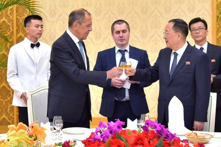 Russian Foreign Minister Sergei Lavrov toasts with his North Korean counterpart Ri Yong Ho during a meeting in Pyongyang, North Korea in this handout picture released by KCNA