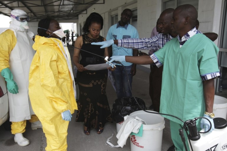 A health worker sprays a colleague with disinfectant during a training session for Congolese health workers to deal with Ebola virus in Kinshasa October 21, 2014. [File: Coulibaly/Reuters]