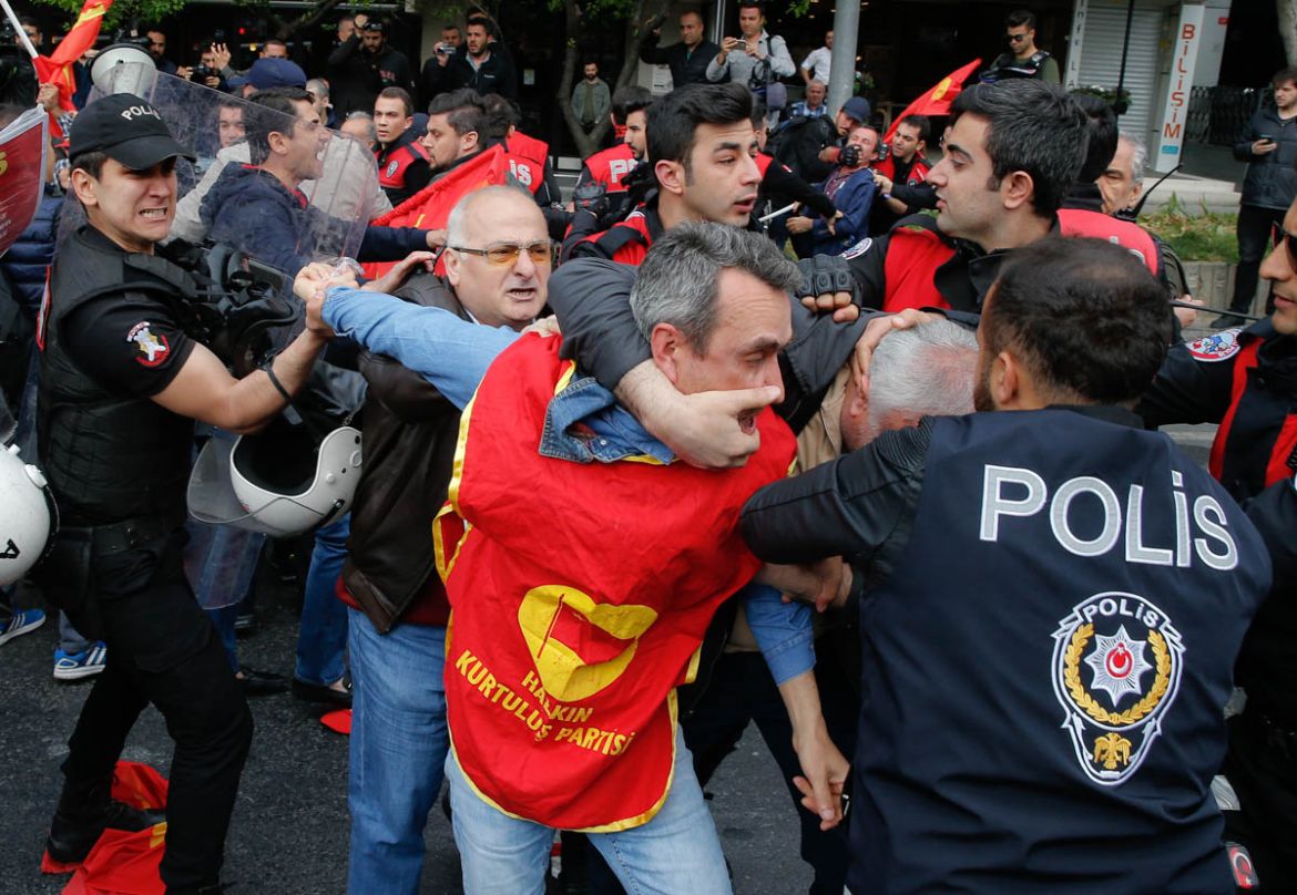 Police scuffle with demonstrators during May Day protests in Istanbul, Turkey, Tuesday, May 1, 2018. Workers and activists mark May Day with defiant rallies and marches for better pay and working cond