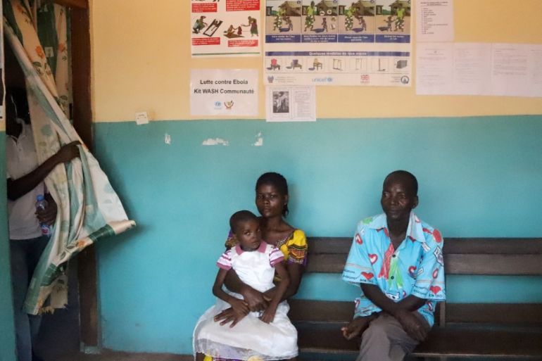 Patients seeking medical attention sit at the health centre in the commune of Wangata, during a vaccination campaign against the outbreak of Ebola, in Mbandaka