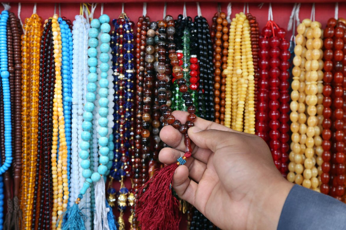 A customer purchases prayer beads ahead of the upcoming holy fasting month of Ramadan in Kabul, Afghanistan, Wednesday, May 16, 2018. Muslims across the world are observing the holy fasting month of R