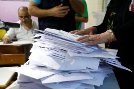 Lebanese election officials count ballots after the polling station closed during Lebanon''s parliamentary election, in Beirut
