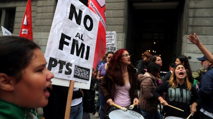 Demonstrators hold a sign that reads "No to the IMF" during a protest outside the Congress in Buenos Aires