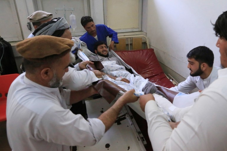 An injured man recevies treatment at a hospital in Jalalabad city, Afghanistan