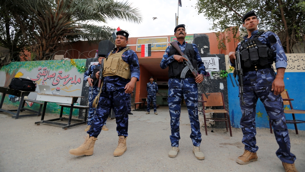 Security was tight at polling stations in Baghdad during Saturday's vote [Wissm al-Okili/Reuters]