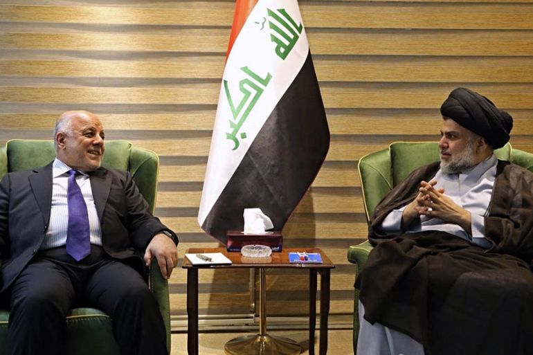 raqi Prime Minister Haider al-Abadi, left, meets with Shiite cleric Muqtada al-Sadr in the heavily fortified Green Zone in Baghdad, Iraq, early Sunday, May 20, 2018.