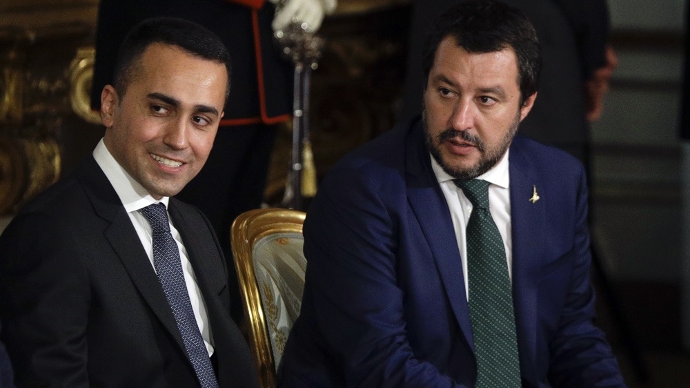 Leader of the League party, Matteo Salvini, right, sits by Luigi Di Maio, leader of the Five-Star movement, prior to the swearing-in ceremony for Italy's new government on June 1, 2018 [Gregorio Borgia/AP] 