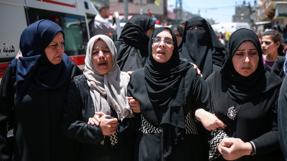 Sabreen al-Najjar, 43, second from right, at the funeral of her daughter Razan al-Najjar which was attended by thousands of people [Hossam Salem/Al Jazeera]