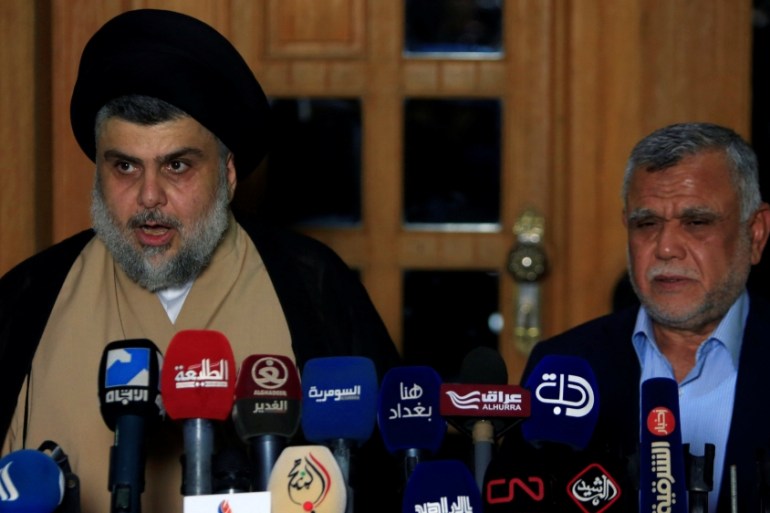 Iraqi Shia cleric Moqtada al-Sadr speaks during a news conference with Leader of the Conquest Coalition and the Iran-backed Shi''ite militia Badr Organisation Hadi al-Amiri, in Najaf