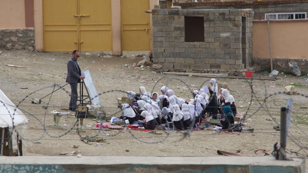 Buildings are reserved for the boys while the girls study outside [Al Jazeera]