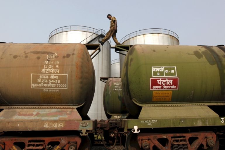 File photo of a worker walking atop a tanker wagon to check the freight level at an oil terminal on outskirts of Kolkata