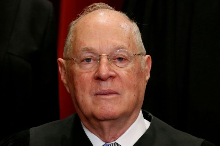 FILE: PHOTO: Justice Kennedy participates in taking a new family photo with fellow justices at the Supreme Court building in Washington