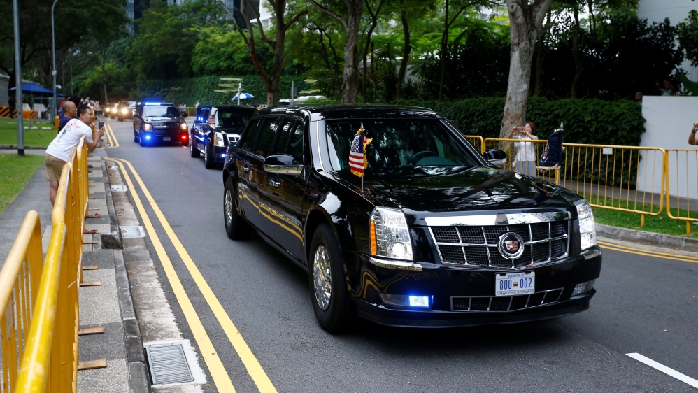 Trump's motorcade heading towards Capella Hotel [Feline Lim/Reuters]