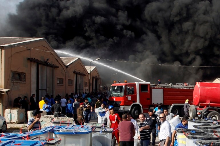 Smoke rises from a storage site in Baghdad, housing ballot boxes from Iraq''s May parliamentary election
