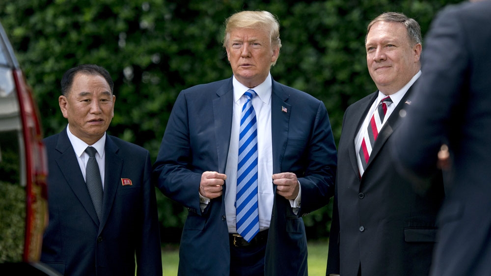Trump, centre, Kim Yong-chol, left, and US Secretary of State Mike Pompeo following their meeting at the White House on Friday [AP]