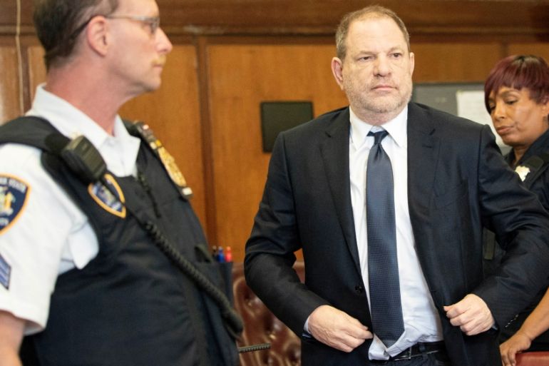 Film producer Harvey Weinstein stands inside Manhattan Criminal Court during his indictment in Manhattan in New York