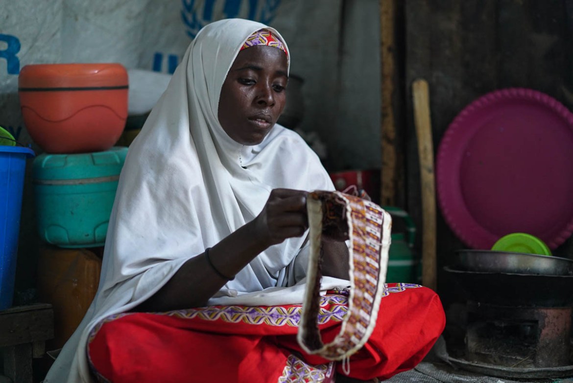 Handicrafts, like cap making, is a common coping strategy for many IDPs to make some money. Falimatu relies on cap making, NGO assistance and begging as ways to support her family.