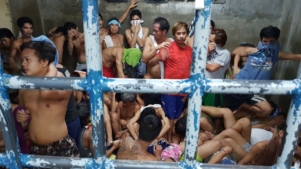 Adults are placed in overcrowded jails while minors sign their names on a list of offenders [JC Gotinga/Al Jazeera]