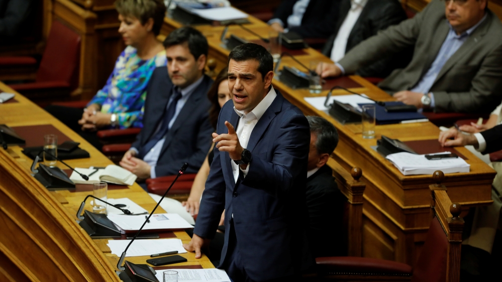 Greek PM Alexis Tsipras addresses the parliament ahead of a debate over the name deal [Alkis Konstantinidis/Reuters]