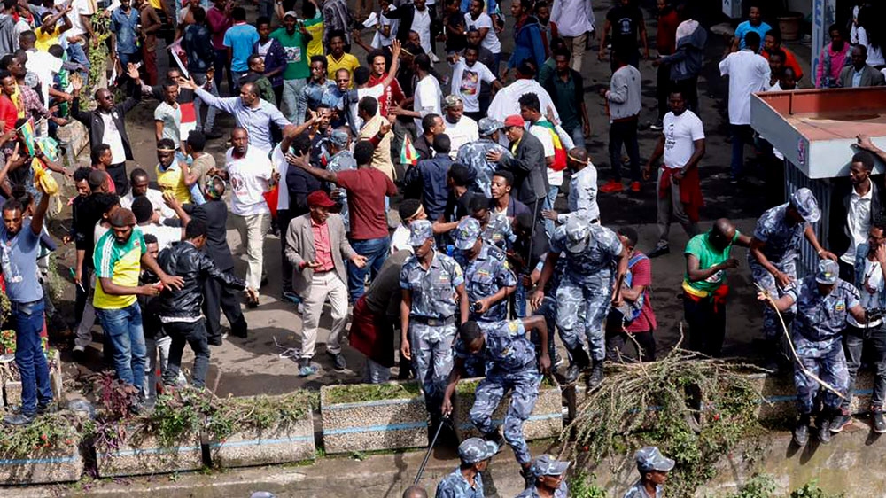 Ethiopian security forces intervene on Meskel Square in Addis Ababa on Saturday [Yonas Tadese/AFP] 