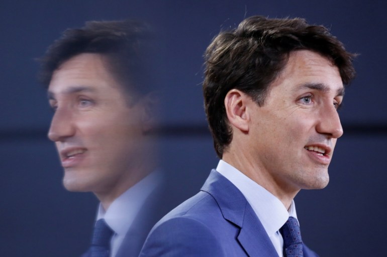 Canada''s PM Trudeau is reflected in a monitor while speaking during a news conference in Ottawa