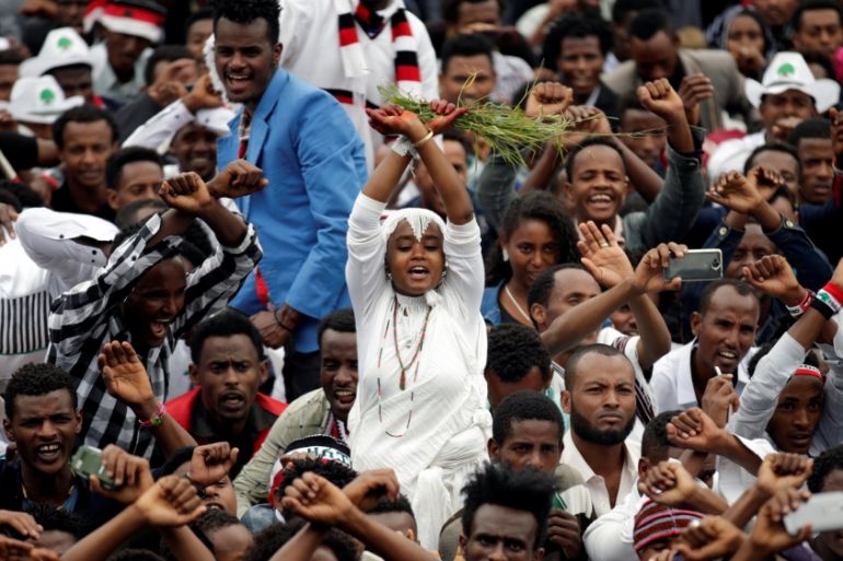 A demonstrator chants slogans while flashing the Oromo protest gesture during celebrations for Irreecha, the thanksgiving festival of the Oromo people, in Bishoftu town, Oromia region