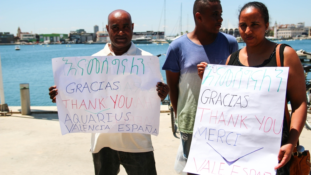 Gima Ayele, who moved from Ethiopia to Valencia 10 years ago, and his family welcome the MV Aquarius [Ruairi Casey/Al Jazeera]