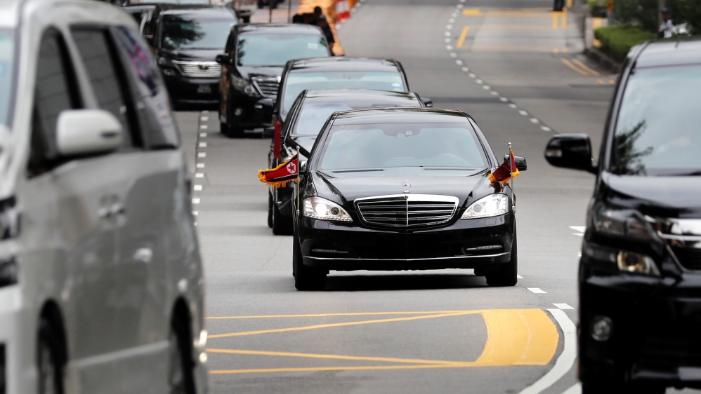 Kim's motorcade heading towards the summit site in Singapore [Tyrone Siu/Reuters]
