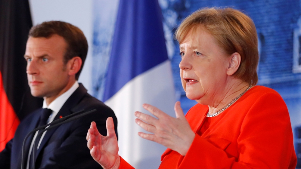 Macron and Merkel met in hopes of finding a joint Franco-German stance on European migration policy [Hannibal Hanschke/Reuters]