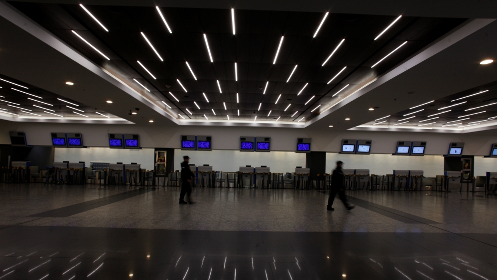 Two policemen walk in the hall in the Jorge Newbery airport in Buenos Aires [Martin Acosta/Reuters]