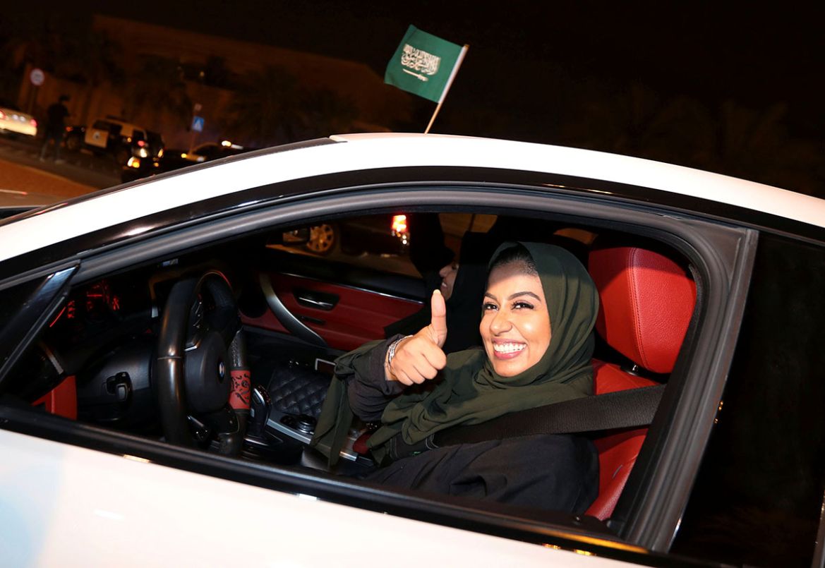 A Saudi woman celebrates as she drives her car in her neighborhood, in Al Khobar, Saudi Arabia, June 24, 2018. REUTERS/Hamad I Mohammed