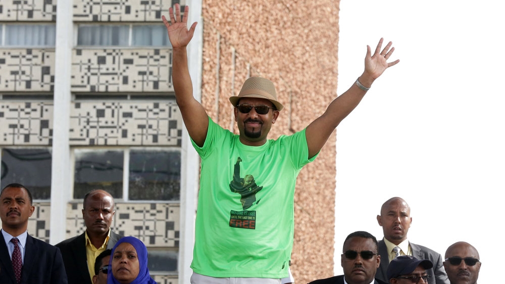 Abiy waves to supporters at the rally before the explosion [Reuters]