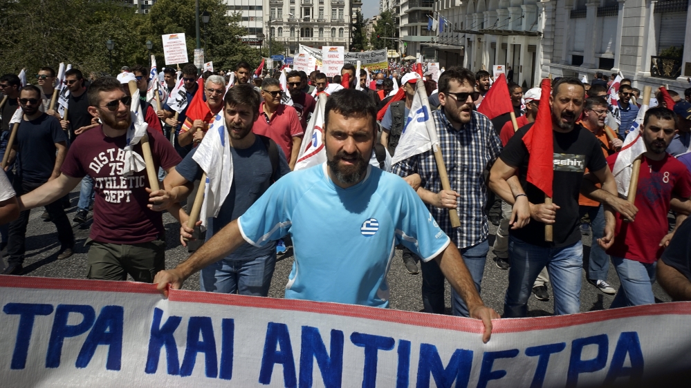 People take part in a demonstration marking a 24-hour general strike in May against austerity measures [Milos Bicanski/Getty Images]