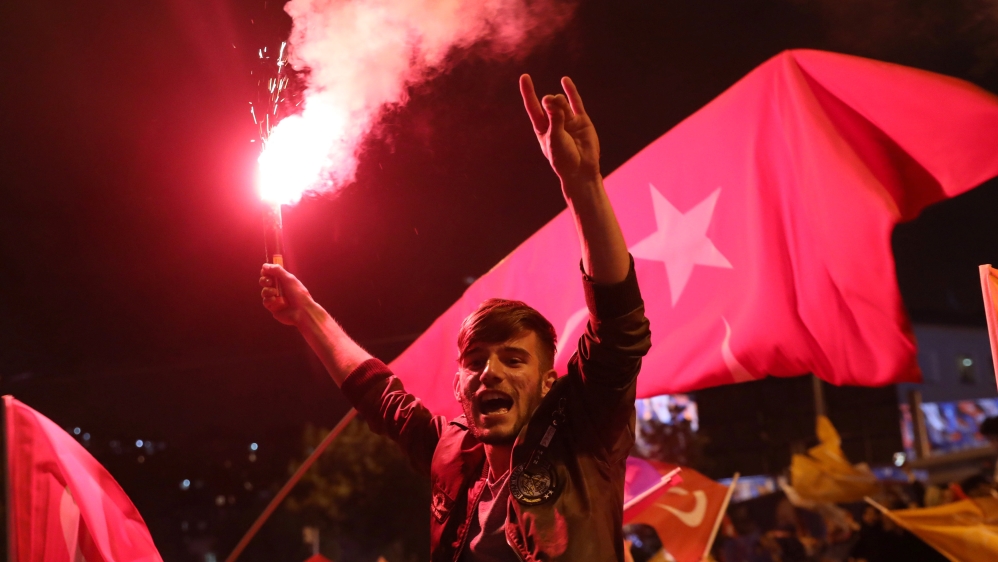 Erdogan supporters cheer in front of Turkey's ruling AK Party headquarters in Istanbul [Goran Tomasevic/Reuters]