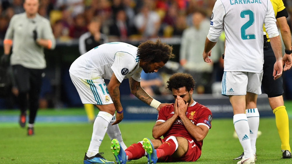 Mohamed Salah of Liverpool reacts after a tackle during the UEFA Champions League final between Real Madrid and Liverpool FC at the NSC Olimpiyskiy stadium in Kiev, Ukraine, May 26, 2018 [Georgi Licovski/EPA-EFE] 