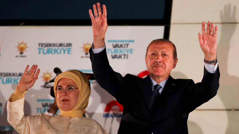 The president and his wife, Emine Erdogan, greet supporters in Ankara [Umit Bektas/Reuters]
