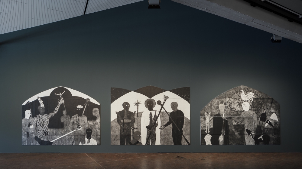 In one of the largest rooms of ADK, La Consagracion I, II, III (1991) - an impressive black, white, and grey-scale triptych of collagraphy works, akin to altar-pieces - and nine other smaller works by Belkis Ayon are on display. [Belkis Ayon, installation view, 10th Berlin Biennale, ADK/  Timo Ohler]
