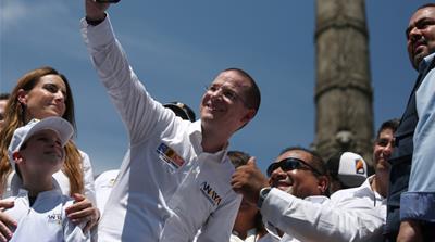 Ricardo Anaya, presidential candidate for the National Action Party (PAN), takes a selfie [Alexandre Meneghini/Reuters]