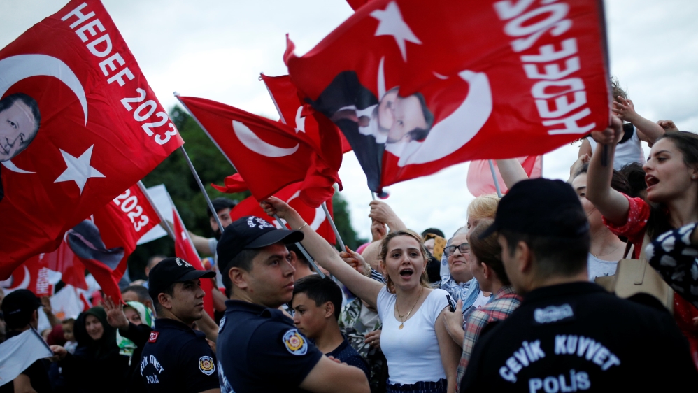 AK Party supporters wave flags in Turkey's largest city, Istanbul [Alkis Konstantinidis/Reuters]