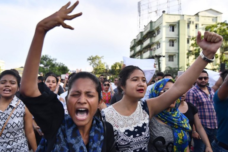 Indian students shout slogans during a protest march demanding to arrest and punish the culprits involved in the killing of two youth in Karbi Anglong district of Assam, in Guwahati on June 10, 2018.