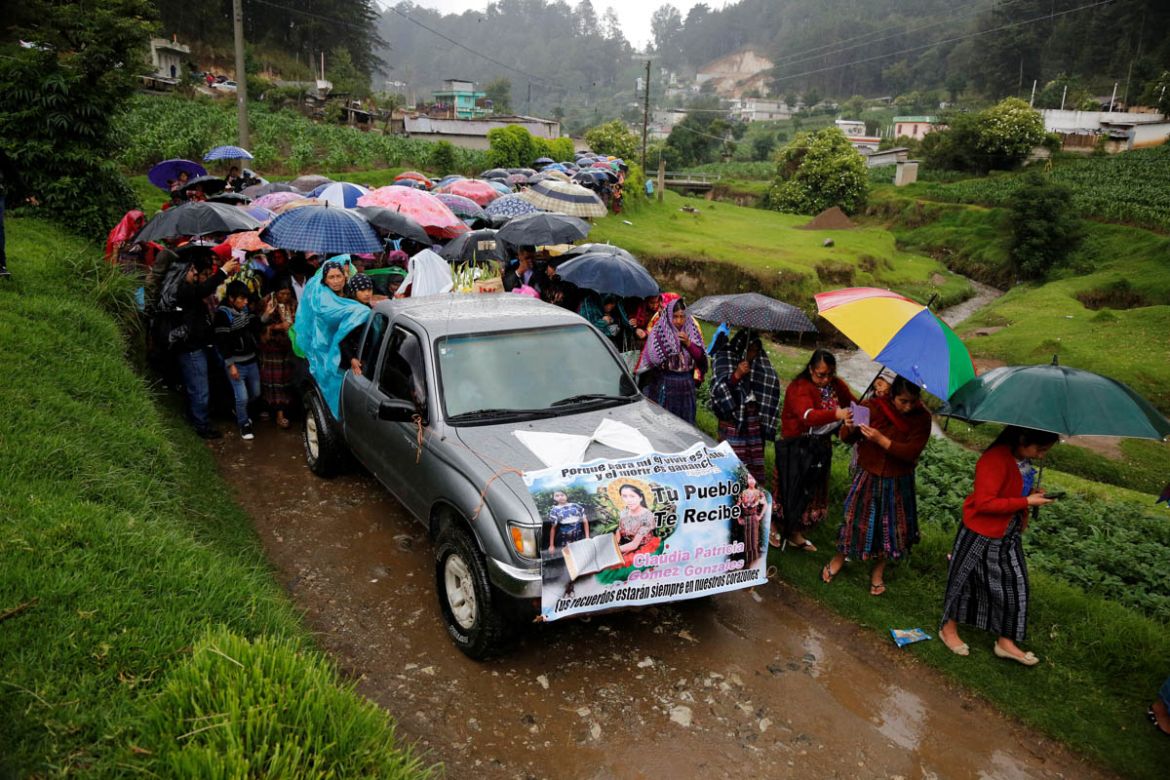 Relatives and friends of Claudia Gomez, a 19-year old Guatemalan immigrant who was shot by a U.S. Border Patrol officer, take part in her funeral procession towards a cemetery in San Juan Ostuncalco,