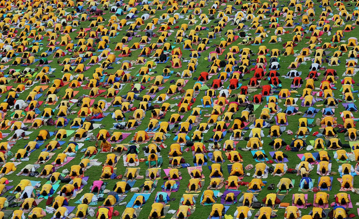 A general view showing hundreds of people performing yoga during 4th International Day of Yoga in Bangalore, India, 21 June 2018. The United Nations (UN) has declared 21 June as the International Yoga