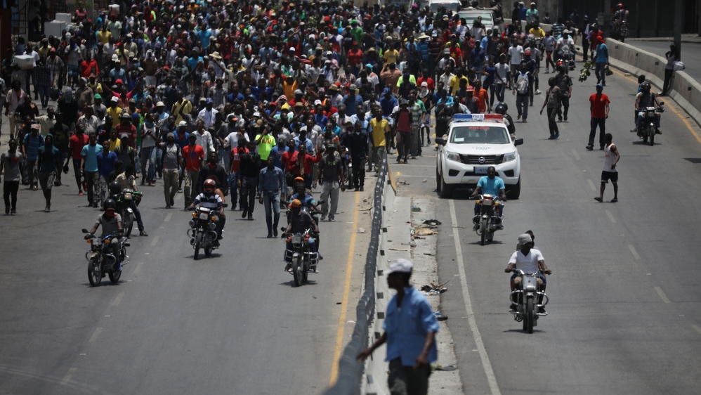 Demonstrators march on Saturday in Port-au-Prince [Andres Martinez Casares/Reuters]