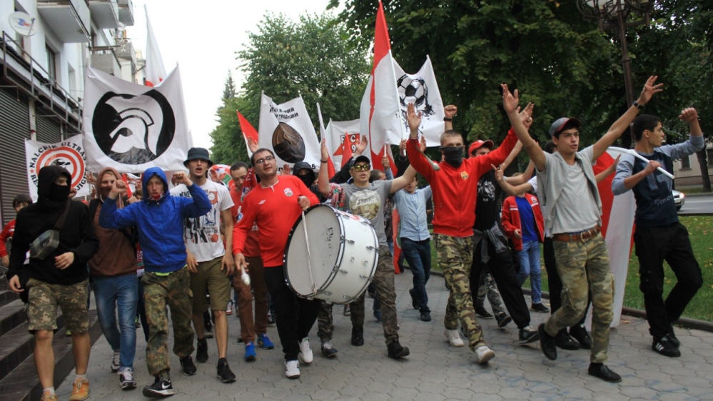 Murat Mizov with Red-White Djigits ultras at a march on the way to a match between Spartak Nalchik and Amkar Perm in 2015 [Courtesy of R.W.D.] 