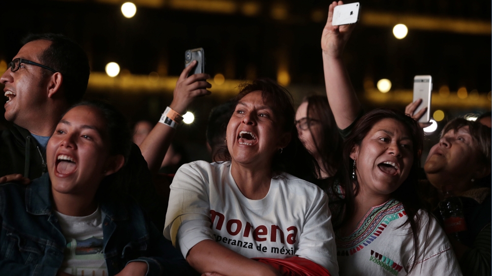 Supporters of Lopez Obrador celebrate his apparent victory in Mexico City's main square, the Zocalo [Moises Castillo/AP Photo]