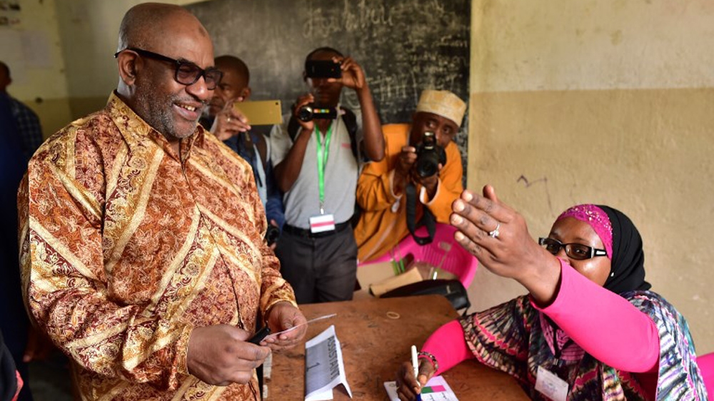 Comoros' President Azali Assoumani, left, will now be able to run for re-election following the politically explosive referendum [Tony Karumba/AFP]