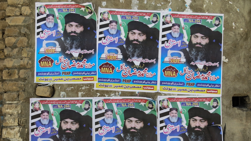 Ramzan Mengal's election posters carry a picture of himself, as well as of ASWJ chief Ahmed Ludhianvi (top left). He is fighting under the election symbol of an 
