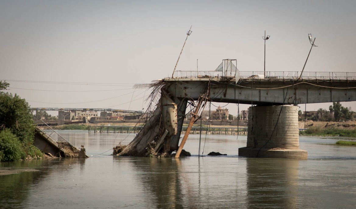 Photo 19 A destroyed bridge on the Tigris river. Most of the bridges linking the eastern and western parts of the city were destroyed. Only a few have been partially rebuilt with often only one lane,
